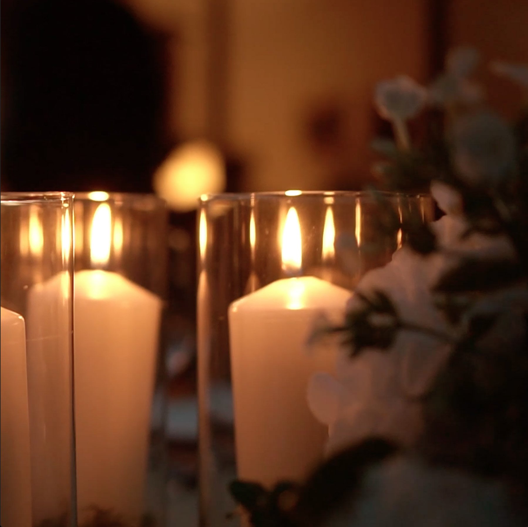 A closeup of an event table with candles