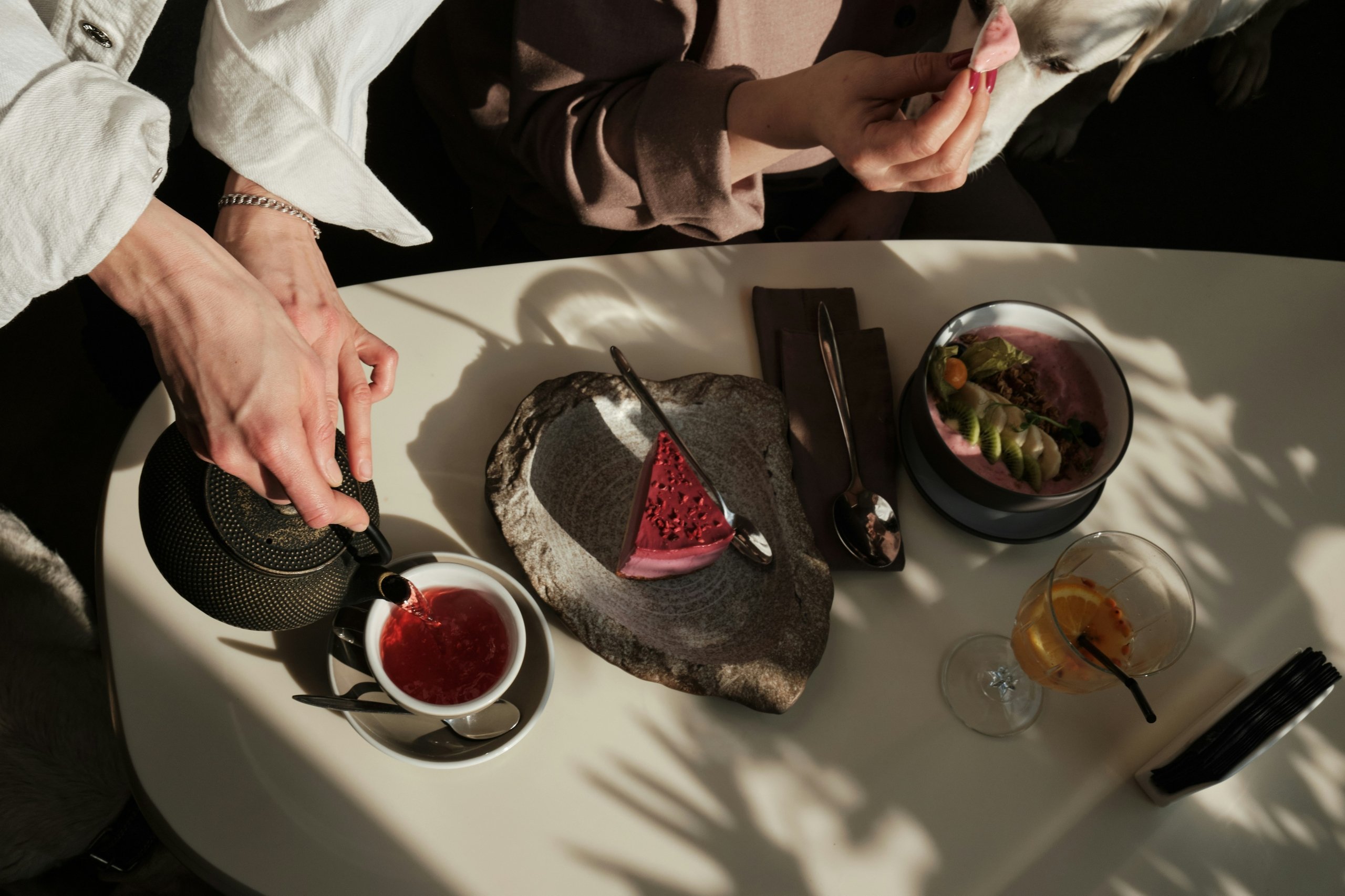 An overview shot of a restaurant table where a woman is having lunch