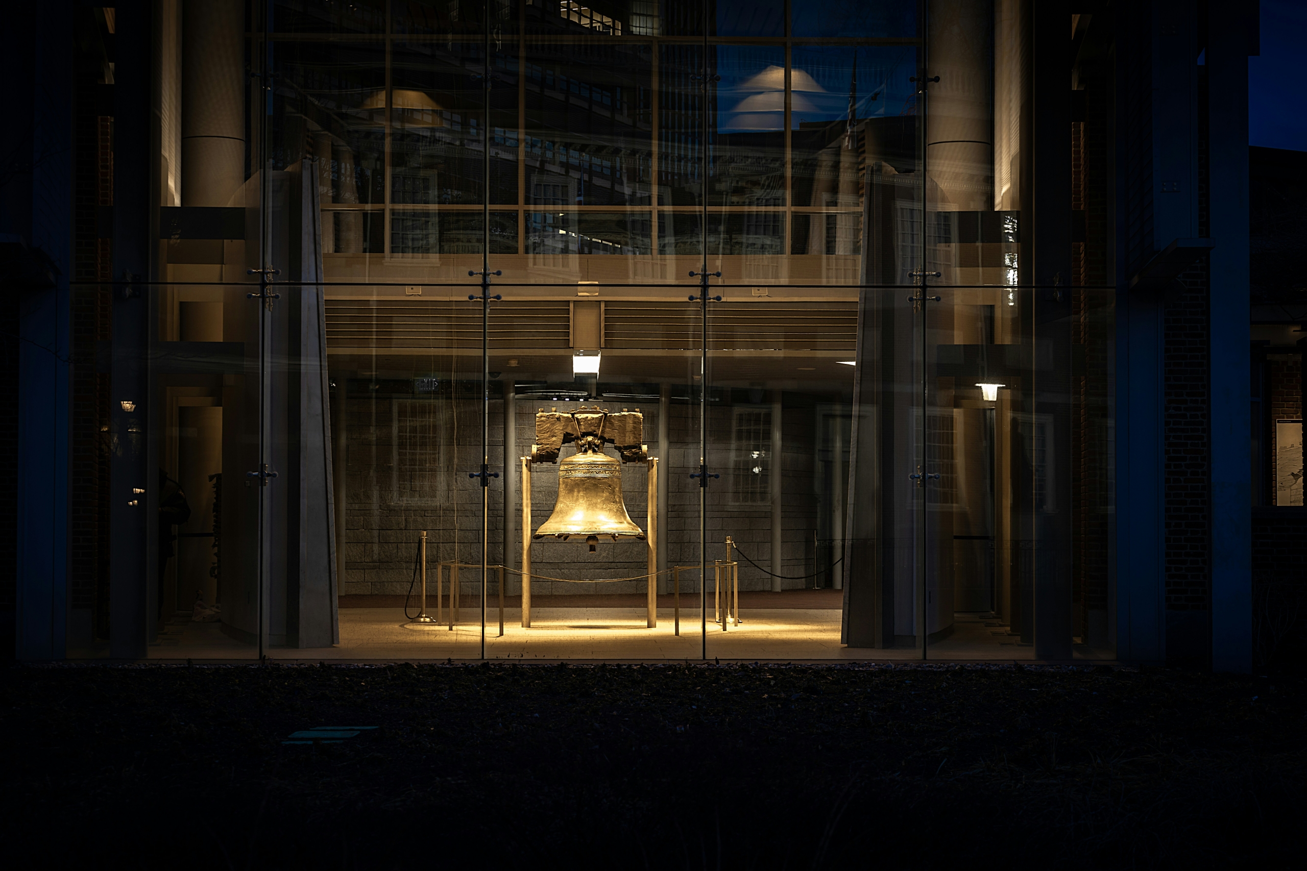 A shot of the Liberty Bell through glass.